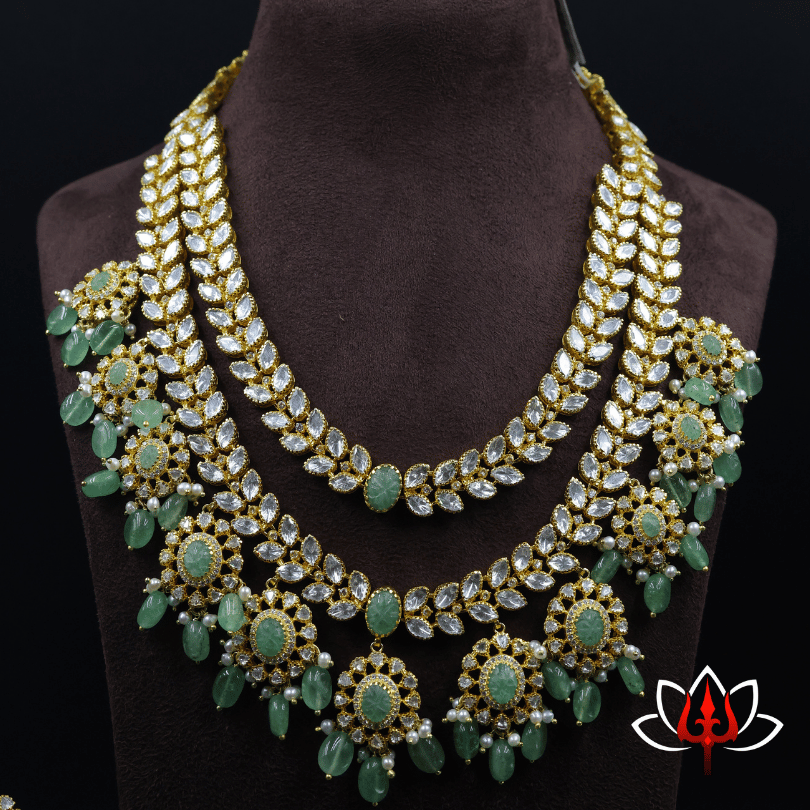 Silver Adorned with Sparkling Stones & Green Gem Drops